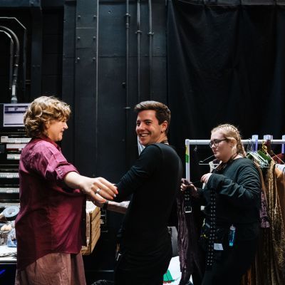 Costume Assistants fitting costume on an actor